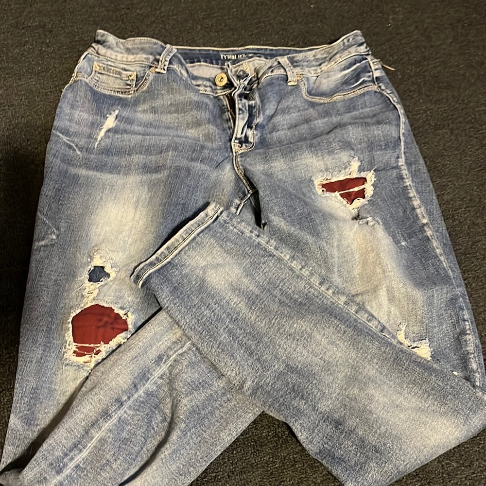 Skinny leg jeans with holes and some patches